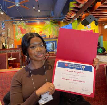 Temi holding her 1st place Certificate 